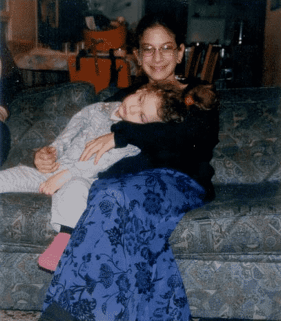 Holding her little sister, Haya Elisheva