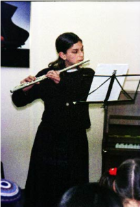 Playing the classical flute at a recital in Jerusalem, April 2001.