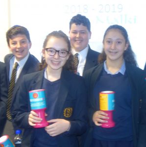 4 boys & girls with charity boxes